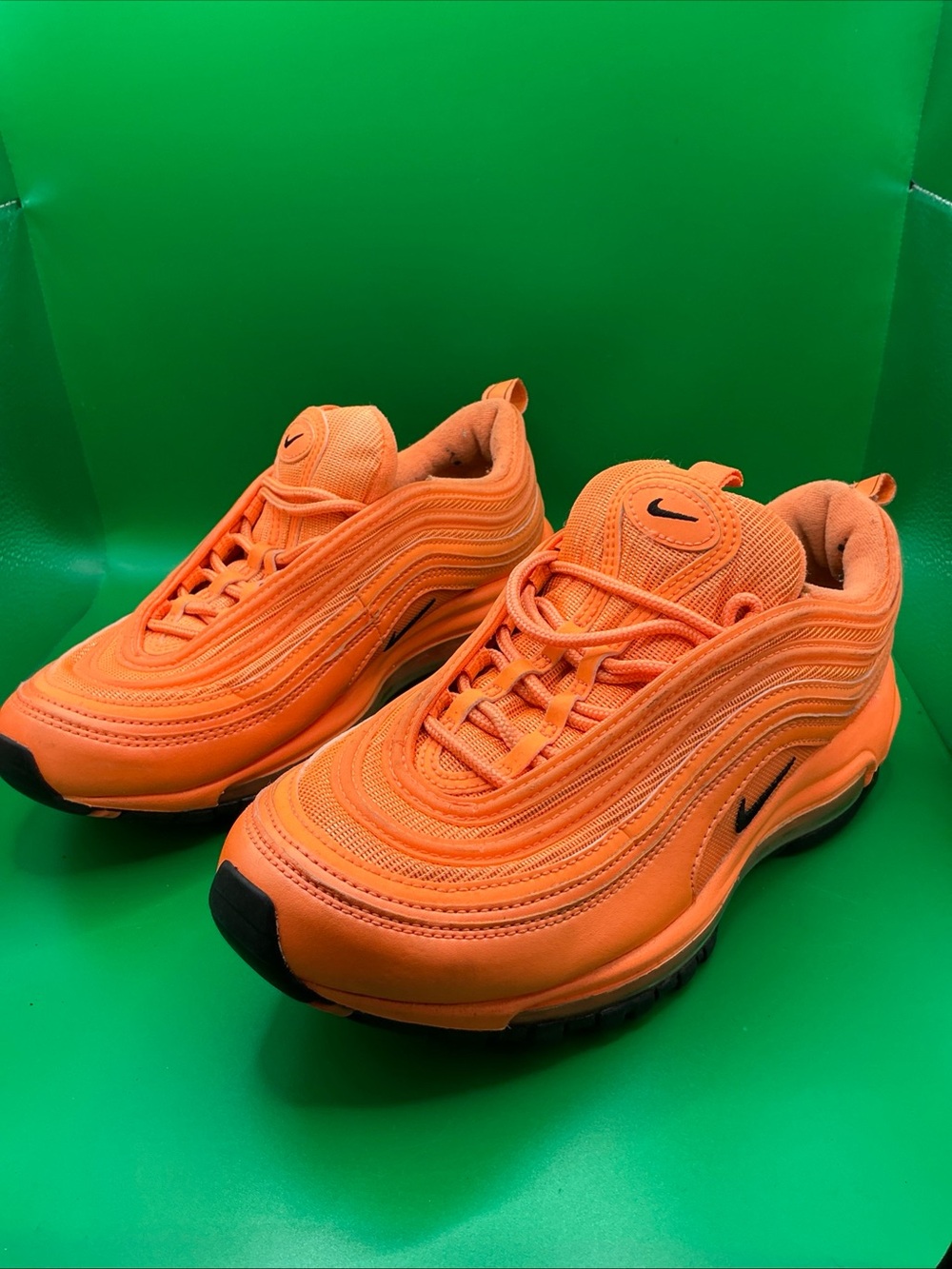 Nike men’s Orange Wave-Textured Sneakers with Black Swoosh